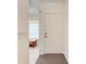 Well-lit entryway with white door and tiled floor at 1705 Curry Ave # 85, Nokomis, FL 34275