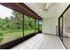 Relaxing screened patio with view of lush greenery at 1705 Curry Ave # 85, Nokomis, FL 34275