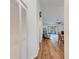 Bright hallway with laminate wood floor, leading to living area at 1705 Curry Ave # 85, Nokomis, FL 34275
