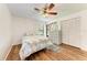 Bedroom with a queen bed, wood floors, and large closet at 1705 Curry Ave # 85, Nokomis, FL 34275