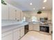 Well-equipped kitchen featuring stainless steel appliances and ample cabinetry at 1705 Curry Ave # 85, Nokomis, FL 34275