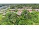 Aerial view of a community with single-Gathering homes and lush greenery at 1705 Curry Ave # 85, Nokomis, FL 34275