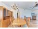 Spacious dining room, hardwood floors, and chandelier at 1705 Curry Ave # 85, Nokomis, FL 34275