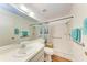Accessible bathroom with walk-in shower, grab bars, and tiled walls at 1705 Curry Ave # 85, Nokomis, FL 34275