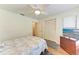 Serene bedroom featuring wood-look floors and large closet at 1705 Curry Ave # 85, Nokomis, FL 34275