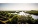 Aerial perspective of a serene waterway, bordered by mangrove trees and lush vegetation at 9970 Key Haven Rd, Seminole, FL 33777