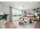 Spacious main bedroom with a large window, a tropical-themed wall, and a comfortable sitting area at 9970 Key Haven Rd, Seminole, FL 33777