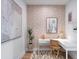 Dedicated home office space with a corner desk and wood-like wallcovering at 9966 Key Haven Rd, Seminole, FL 33777