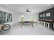 Game room with ping pong table and bar area at 9966 Key Haven Rd, Seminole, FL 33777