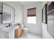 Modern bathroom with herringbone tile and a sleek vanity at 9966 Key Haven Rd, Seminole, FL 33777