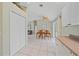 Kitchen and dining area with wood table and chairs, and tile floor at 2484 Cover Ln, North Port, FL 34286