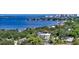 Stunning waterfront home, nestled in a lush, tropical landscape with panoramic views of the bay and cityscape at 1610 N Lodge Dr, Sarasota, FL 34239