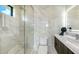 Elegant bathroom showcasing a glass-enclosed shower and modern vanity with stone countertops at 1610 N Lodge Dr, Sarasota, FL 34239