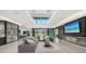 Open-concept living room boasts a modern design, fireplace, wet bar, and expansive outdoor views at 1610 N Lodge Dr, Sarasota, FL 34239