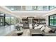 Spacious open-plan living room featuring high ceilings, large windows, and modern decor at 1610 N Lodge Dr, Sarasota, FL 34239