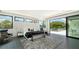 Modern main bedroom with sleek furnishings, a sliding glass doors, and a neutral color palette at 1610 N Lodge Dr, Sarasota, FL 34239