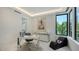 Bright and modern office featuring a sleek desk, stylish seating, and ample natural light at 1610 N Lodge Dr, Sarasota, FL 34239