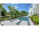 Inviting pool area with modern design and tropical landscaping at 1610 N Lodge Dr, Sarasota, FL 34239