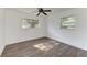 Bright bedroom with wood-look floors and ceiling fan at 818 Padgett Ave, Sarasota, FL 34237
