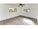 Spacious bedroom featuring wood-look flooring and ample natural light at 818 Padgett Ave, Sarasota, FL 34237