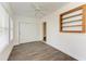 Charming bedroom with built-in shelving and ceiling fan at 818 Padgett Ave, Sarasota, FL 34237
