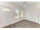 Well-lit bedroom with exterior door and closet at 818 Padgett Ave, Sarasota, FL 34237