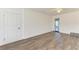 Spacious bedroom with hardwood floors and access to another room at 818 Padgett Ave, Sarasota, FL 34237