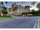 Luxury high rise building with lush landscaping and gated entrance at 818 Padgett Ave, Sarasota, FL 34237