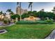 Grand entrance to a luxury building with lush landscaping at 818 Padgett Ave, Sarasota, FL 34237