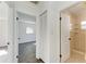Bright hallway with access to bedroom and bathroom at 818 Padgett Ave, Sarasota, FL 34237