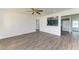 Spacious living room with wood-look floors and ceiling fan at 818 Padgett Ave, Sarasota, FL 34237