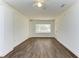 Living room with hardwood floors, bay window, and ceiling fan at 818 Padgett Ave, Sarasota, FL 34237