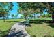 Relaxing waterfront park with a walking path and bench at 818 Padgett Ave, Sarasota, FL 34237