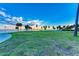 Lush green park with palm trees and a gazebo near the water at 818 Padgett Ave, Sarasota, FL 34237