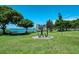 Lush green park with waterfront views and modern art at 818 Padgett Ave, Sarasota, FL 34237