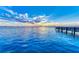 Tranquil sunset view from a pier over calm blue water at 818 Padgett Ave, Sarasota, FL 34237