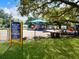 Arlington Park Playground features a shaded play area with slides and playsets at 818 Padgett Ave, Sarasota, FL 34237