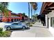 Upscale shopping district with palm trees and parked cars at 818 Padgett Ave, Sarasota, FL 34237