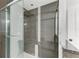 Walk-in shower with modern gray tile and glass enclosure at 818 Padgett Ave, Sarasota, FL 34237
