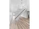 Open concept living area with modern staircase at 2955 N Beach Rd # A531, Englewood, FL 34223