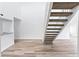 Modern white staircase leading to an upper loft at 2955 N Beach Rd # A531, Englewood, FL 34223