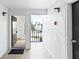 Clean hallway with access to a condo unit and balcony view at 2955 N Beach Rd # A531, Englewood, FL 34223