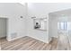 Spacious living area with light flooring and kitchen view at 2955 N Beach Rd # A531, Englewood, FL 34223
