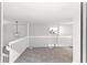 Bright loft area with water views and neutral carpeting at 2955 N Beach Rd # A531, Englewood, FL 34223