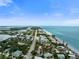 Aerial view of coastal town; beachfront properties visible at 2955 N Beach Rd # A531, Englewood, FL 34223