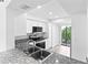 Modern kitchen with granite countertops and balcony view at 2955 N Beach Rd # A531, Englewood, FL 34223