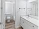 Bright bathroom with a vanity, toilet and shower/tub combo at 2955 N Beach Rd # A531, Englewood, FL 34223