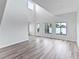 Spacious living room with hardwood floors and large windows at 2955 N Beach Rd # A531, Englewood, FL 34223