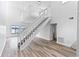 Open living room with loft and hardwood floors at 2955 N Beach Rd # A531, Englewood, FL 34223