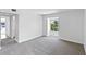 Simple bedroom with neutral carpeting and a window at 2955 N Beach Rd # A531, Englewood, FL 34223